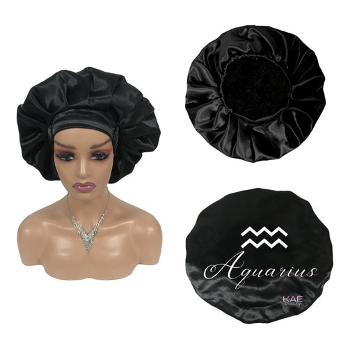 Black silk bonnet on a mannequin head and two additional bonnets with 'Aquarius' design.