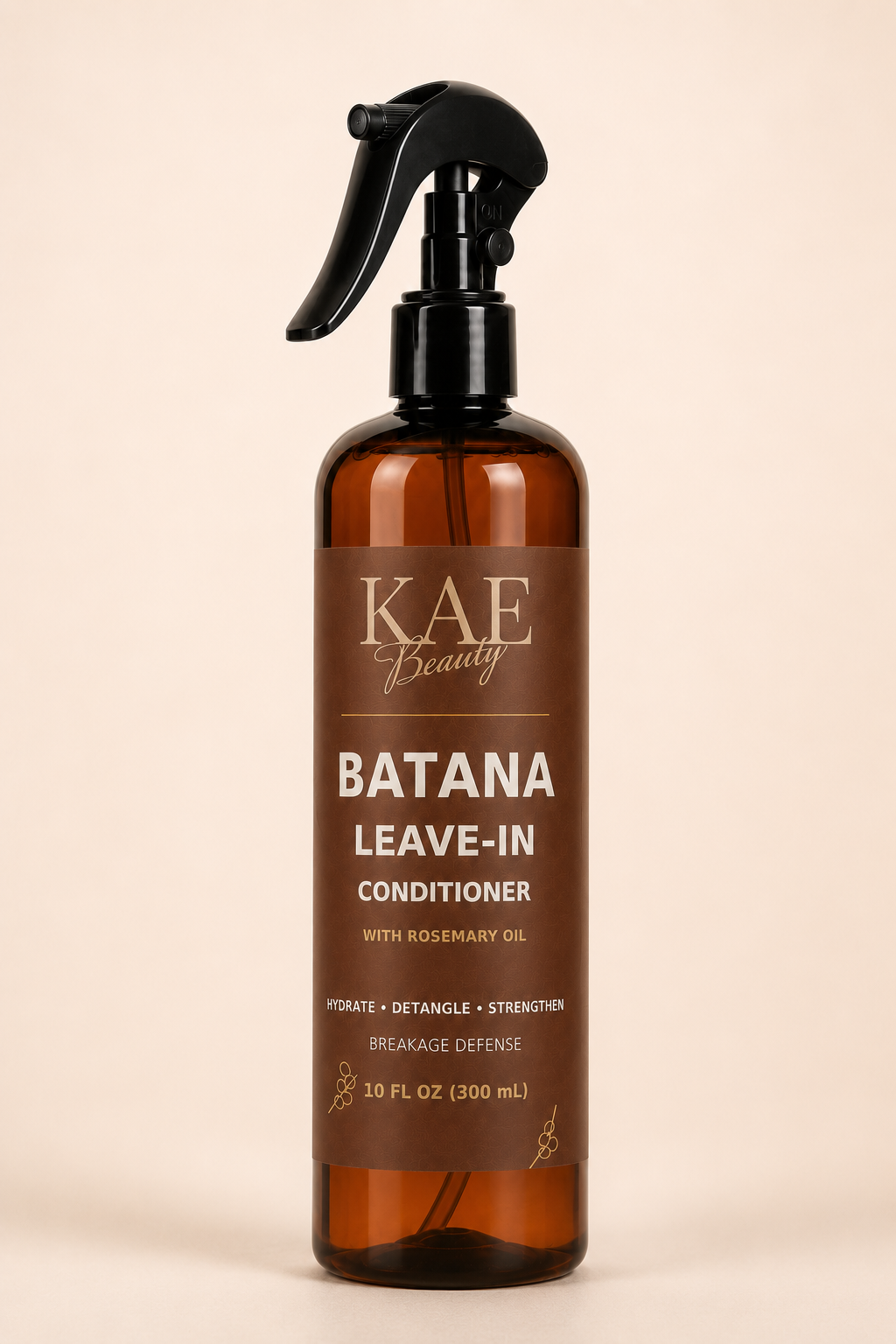 KAE Beauty Batana Leave-In Conditioner with Rosemary Oil in a 10 fl oz amber spray bottle on a light background